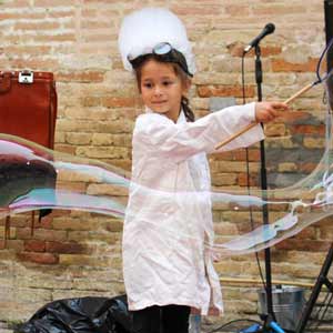 Girl makes bubbles in Italy